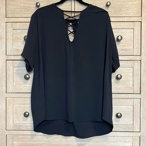 Black top with cutout detail and small keyhole back